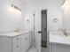 Bright and modern bathroom with double vanity, marble countertop, and gold fixtures at 1199 Island View Dr, Mount Pleasant, SC 29464