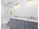 Elegant bathroom features double sinks with gray cabinetry and modern lighting fixtures at 1199 Island View Dr, Mount Pleasant, SC 29464