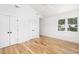 Light-filled bedroom boasts hardwood floors, a ceiling fan, and white trim at 1199 Island View Dr, Mount Pleasant, SC 29464