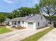 A single-story home with a gray roof, beautiful windows, an attached garage, and healthy green grass at 1199 Island View Dr, Mount Pleasant, SC 29464
