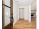 Stylish foyer featuring hardwood floors, a paneled front door, and inviting views into the living space at 1199 Island View Dr, Mount Pleasant, SC 29464