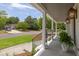 Inviting covered porch with stylish lighting and fresh landscaping, creating a welcoming entrance at 1199 Island View Dr, Mount Pleasant, SC 29464
