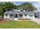 Charming, single-story home boasts a well-manicured lawn and an attached garage with a beautiful driveway at 1199 Island View Dr, Mount Pleasant, SC 29464