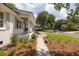 The house has a well-maintained yard, a walkway to the front porch, and decorative plantings at 1199 Island View Dr, Mount Pleasant, SC 29464