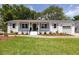 Inviting single-story home with fresh landscaping and a well-maintained lawn, exuding curb appeal at 1199 Island View Dr, Mount Pleasant, SC 29464
