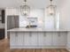 Kitchen island with white countertops, stainless steel appliances, and overhead lighting at 1199 Island View Dr, Mount Pleasant, SC 29464