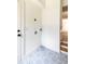 Laundry room with decorative tile flooring and access to stairs and backyard at 1199 Island View Dr, Mount Pleasant, SC 29464