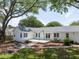 Rear exterior showing white painted brick, patio, and ample backyard space at 1199 Island View Dr, Mount Pleasant, SC 29464