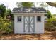 Charming backyard shed with crossbuck doors and window at 1199 Island View Dr, Mount Pleasant, SC 29464