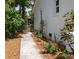 Landscaped side yard with a charming walkway and a wooden gate at 1199 Island View Dr, Mount Pleasant, SC 29464