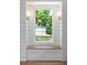 Cozy window seat nook with hardwood floors, shiplap walls, and backyard views at 1199 Island View Dr, Mount Pleasant, SC 29464