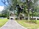 Lovely single-story home featuring an attached garage, mature trees, and a driveway in a quiet setting at 120 Wanda Dr, Summerville, SC 29485