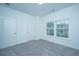 Comfortable bedroom features plush carpet, a large closet, and two windows for ample natural light at 1202 Twin Rivers Dr, Wando, SC 29492
