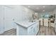 Kitchen island with granite countertop and stainless steel appliances in an open floor plan at 1202 Twin Rivers Dr, Wando, SC 29492