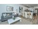 Open-concept interior with stylish living area, modern furnishings, and adjacent kitchen at 1202 Twin Rivers Dr, Wando, SC 29492