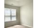Sunlit bedroom featuring wood floors and a window with blinds at 1225 Blakeway St # 703, Charleston, SC 29492