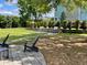 Community space including a lawn, grilling area, landscaping and an outdoor living space at 1225 Blakeway St # 703, Charleston, SC 29492