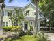 Charming two-story home with light green siding, black shutters, and a well-manicured front yard at 1225 Blakeway St # 703, Charleston, SC 29492