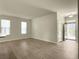 Bright living room with wood floors and natural light streaming through the windows at 1225 Blakeway St # 703, Charleston, SC 29492