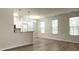 Open-concept living room and kitchen area with modern flooring and abundant natural light at 1225 Blakeway St # 703, Charleston, SC 29492