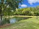 Picturesque pond with lush green surroundings, offering a tranquil escape at 1225 Blakeway St # 703, Charleston, SC 29492