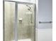 Shower with tiled walls and glass doors at 1225 Blakeway St # 703, Charleston, SC 29492