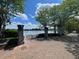 Scenic walking path with lush greenery, bench seating and views of the water at 1225 Blakeway St # 703, Charleston, SC 29492