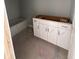 Unfinished bathroom featuring a tub, white cabinets and stainless pulls at 127 Seaton St, Summerville, SC 29486