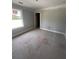 Unfinished bedroom featuring trim detail and a view through the window at 127 Seaton St, Summerville, SC 29486