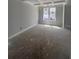 Spacious room with decorative ceiling and natural light from a large window awaits your personal touch at 127 Seaton St, Summerville, SC 29486