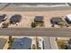 Aerial view of beachfront homes with sandy beach and ocean waves at 128 Palmetto Blvd, Edisto Beach, SC 29438