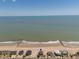 Aerial view of beachside home with the ocean in the background on a bright sunny day at 128 Palmetto Blvd, Edisto Beach, SC 29438
