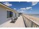 Spacious outdoor deck with direct beach access, featuring ocean views and comfortable seating at 128 Palmetto Blvd, Edisto Beach, SC 29438