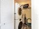 This laundry closet includes a stacked washer/dryer and plenty of room for storage of other household items at 128 Palmetto Blvd, Edisto Beach, SC 29438
