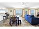Inviting living area with ocean views, couch and natural light at 128 Palmetto Blvd, Edisto Beach, SC 29438