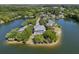 Aerial view of waterfront home surrounded by trees on a peninsula at 1391 Royston Rd, Mount Pleasant, SC 29464