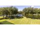 Scenic backyard featuring a well-manicured lawn, a picturesque view of the water, and a stone patio with seating at 1391 Royston Rd, Mount Pleasant, SC 29464