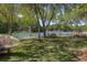 Serene backyard with a lush lawn, waterfront access, and a peaceful spot to enjoy nature's beauty at 1391 Royston Rd, Mount Pleasant, SC 29464