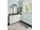Bathroom featuring a vanity with granite countertop, storage, and a large window for natural light at 1391 Royston Rd, Mount Pleasant, SC 29464