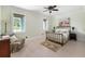 Serene bedroom featuring a metal bed frame, hardwood floors, and ample natural light, creating a relaxing atmosphere at 1391 Royston Rd, Mount Pleasant, SC 29464