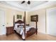 Bedroom featuring hardwood floors, four-poster bed, and tray ceiling with fan at 1391 Royston Rd, Mount Pleasant, SC 29464