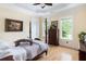 Traditional bedroom with hardwood floors, four-poster bed, and bright natural light at 1391 Royston Rd, Mount Pleasant, SC 29464