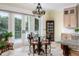 Sunlit breakfast area with French doors and views of the outdoor scenery at 1391 Royston Rd, Mount Pleasant, SC 29464
