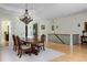 Spacious dining room featuring a statement chandelier and classic wood furnishings at 1391 Royston Rd, Mount Pleasant, SC 29464