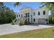 Elegant two-story home with a grand staircase, a spacious driveway, and lush landscaping at 1391 Royston Rd, Mount Pleasant, SC 29464