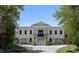 Elegant two-story home featuring a symmetrical facade, double doors, and a welcoming driveway at 1391 Royston Rd, Mount Pleasant, SC 29464