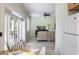 Open floor plan showcasing a living area adjacent to the kitchen, with views of the outdoor patio at 1391 Royston Rd, Mount Pleasant, SC 29464