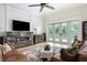 Comfortable living room showcasing a fireplace, large windows, and a cozy atmosphere at 1391 Royston Rd, Mount Pleasant, SC 29464