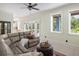 Inviting living room showcasing neutral walls, plush seating, and natural light streaming through large windows at 1391 Royston Rd, Mount Pleasant, SC 29464