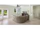 Bright living room featuring light hardwood floors, modern furnishings, and a view of the outdoor landscape at 1391 Royston Rd, Mount Pleasant, SC 29464
